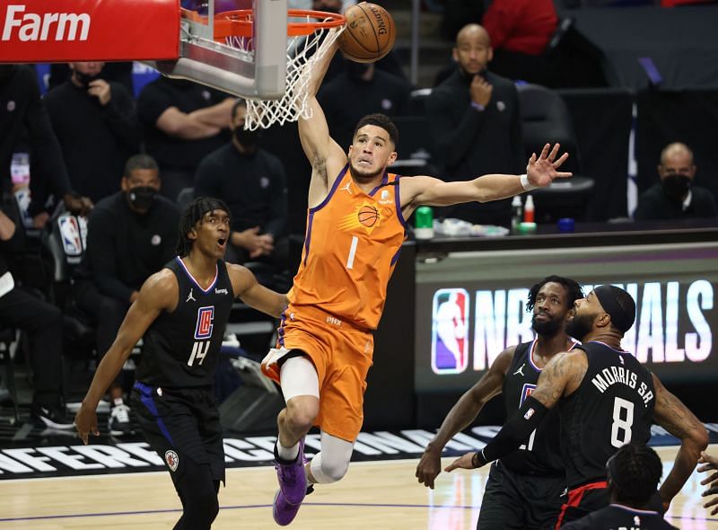 Devin Booker #1 of the Phoenix Suns dunks against the LA Clippers