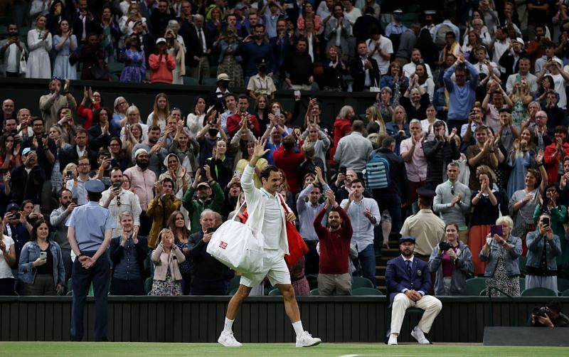 Roger Federer walks off the court after his win.