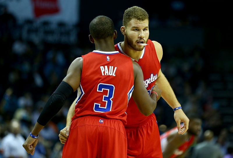 Chris Paul (#3) and teammate Blake Griffin (#32) hug before a game.