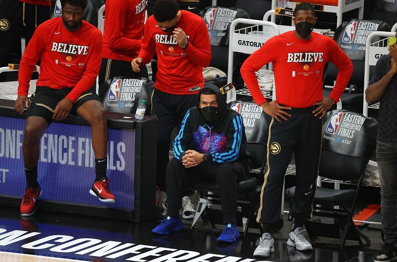 Trae Young #11 of the Atlanta Hawks sits on the bench in Game Four of the Eastern Conference Finals.