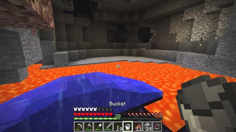 A Minecraft player using a water bucket to create an obsidian pathway (Image via Waifu Simulator on Reddit)