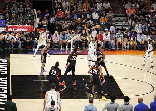 Giannis Antetokounmpo shoots over Deandre Ayton in the 2021 NBA Finals - Game Five