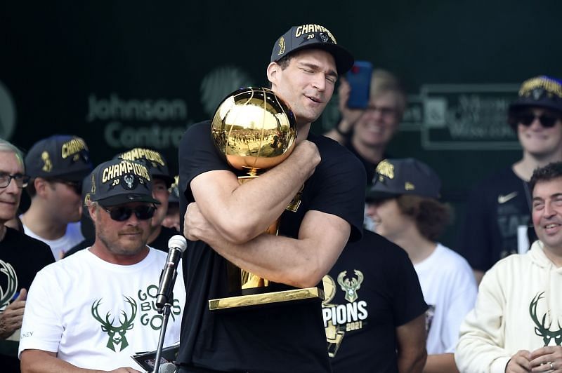 Brook Lopez with the Larry O&#039;Brien Trophy