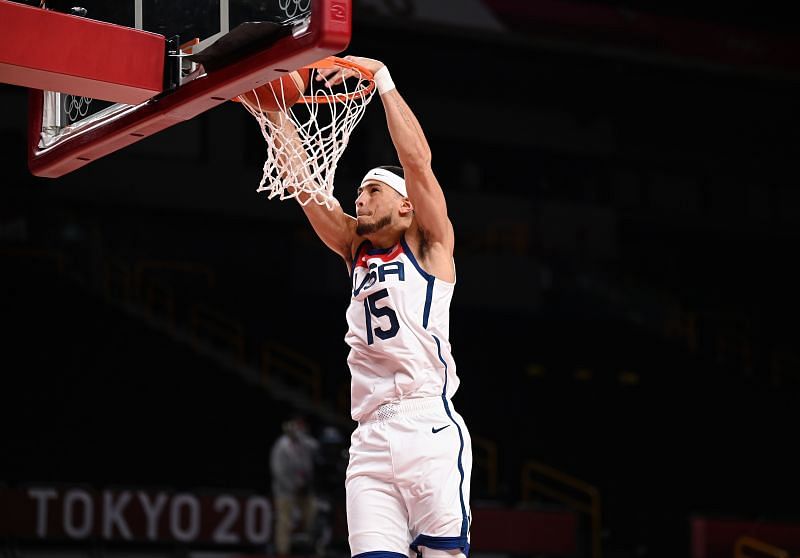 Devin Booker #15 of Team United States dunks against Iran