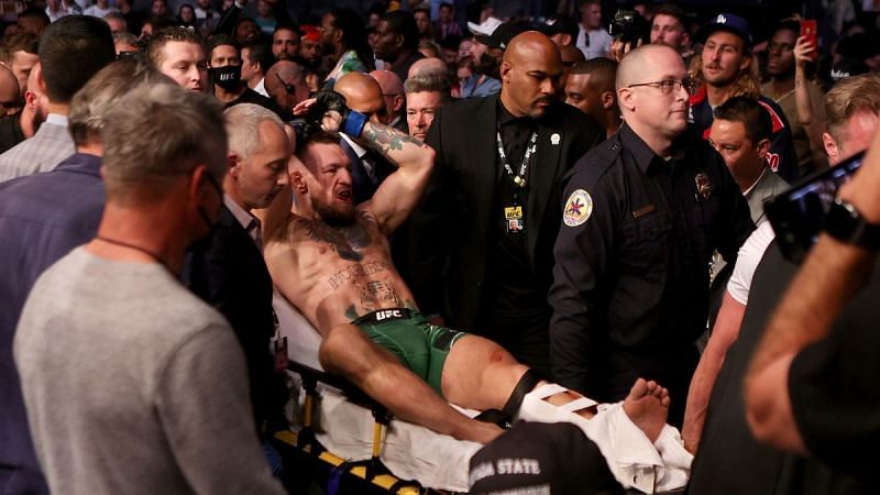 Conor McGregor stretchered out after leg injury at UFC 264