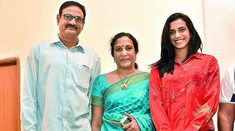PV Sindhu with her parents PV Ramana and P Vijaya.