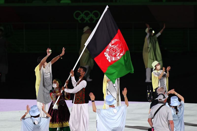 Flag bearers Kimia Yousofi and Farzad Mansouri of Team Afghanistan during the Opening Ceremony