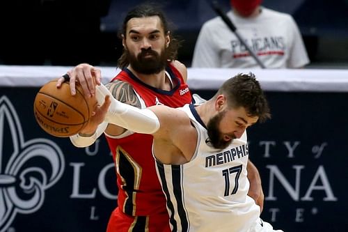 Steven Adams #12 is fouled by Jonas Valanciunas #17.