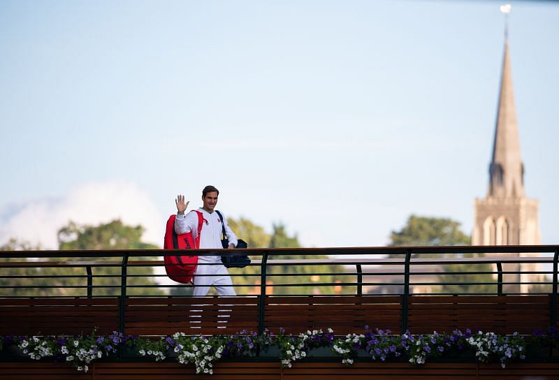 Roger Federer walking across the player&#039;s bridge after his loss