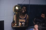 Magic Jonson with the Larry O'Brien trophy (Photo Credit: Focus on Sport via Getty Images)