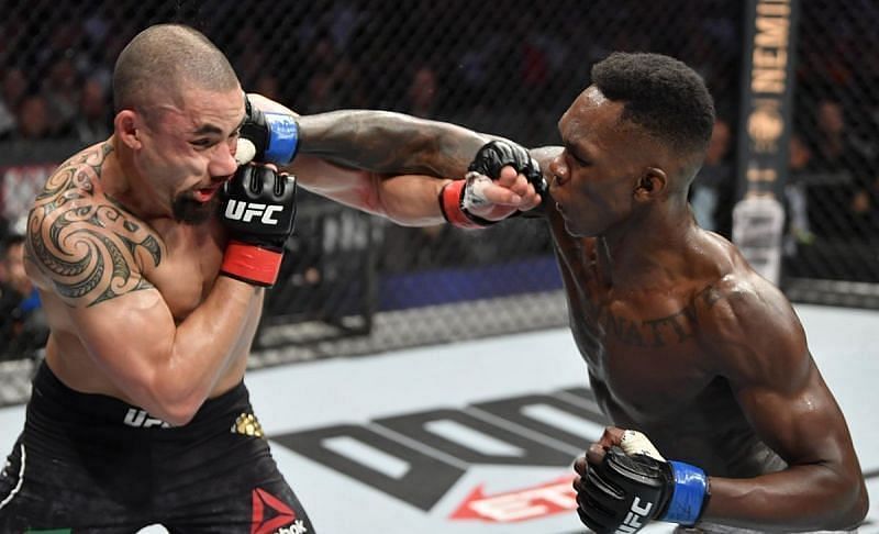 Robert Whittaker (left); Israel Adesanya (right)