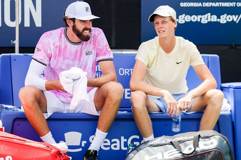 Jannik Sinner (R) with his doubles partner Reilly Opelka (L)