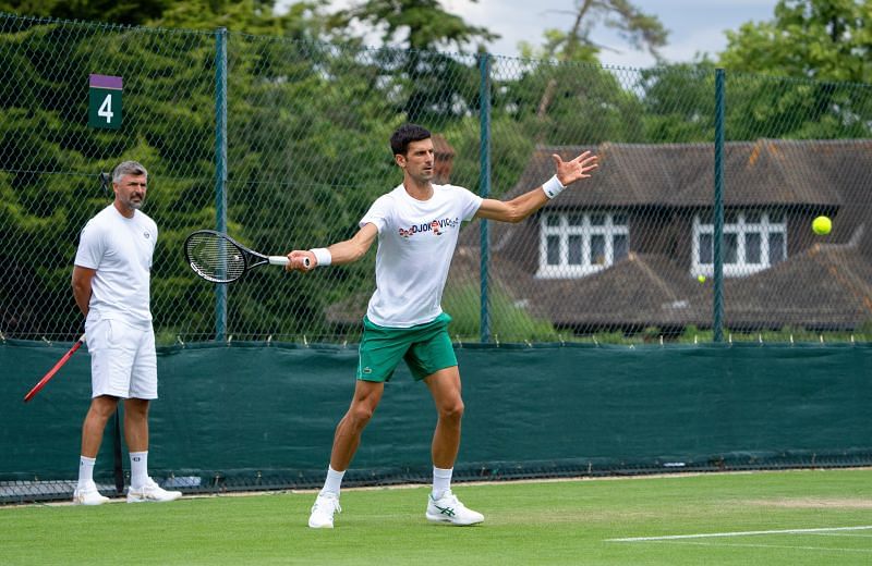 Novak Djokovic trains in front of Goran Ivanisevic at Wimbledon 2021
