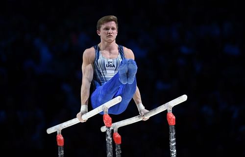 Allan Bower of the USA competes on the parallel bars during the 2019 Gymnastics World Cup at the Resorts World Arena on March 23, 2019 in Birmingham, England. (Photo by Shaun Botterill/Getty Images)