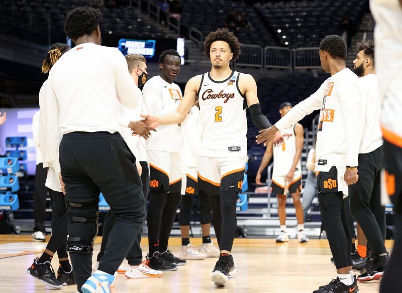 Cade Cunningham #2 of the Oklahoma State Cowboys is welcomed on court by his teammates