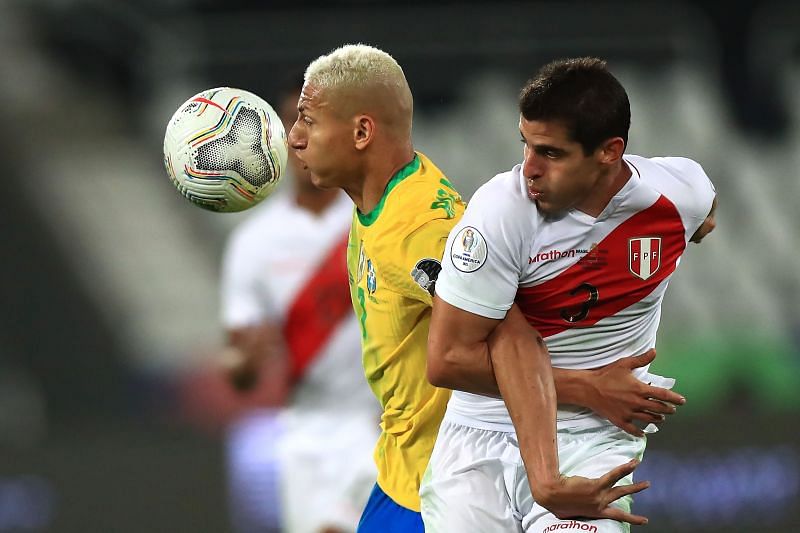 Aldo Corzo (right) tussles it out with Richarlison