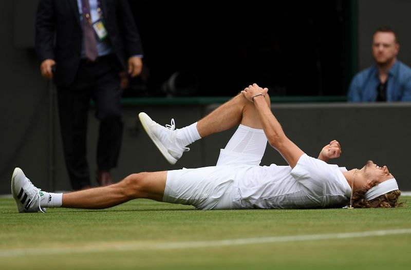 Alexander Zverev takes a tumble during his five-set defeat to Felix Auger-Aliassime at Wimbledon.