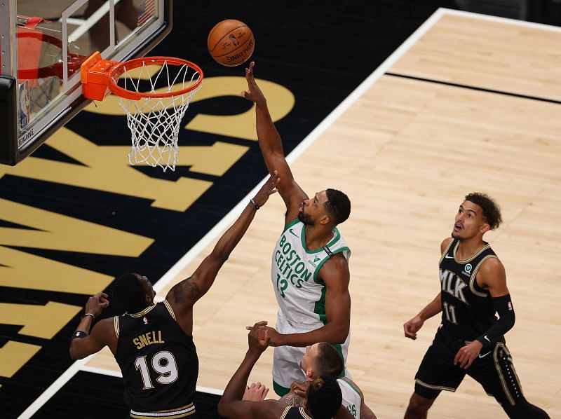 Tristan Thompson #13 of the Boston Celtics tips in a rebound