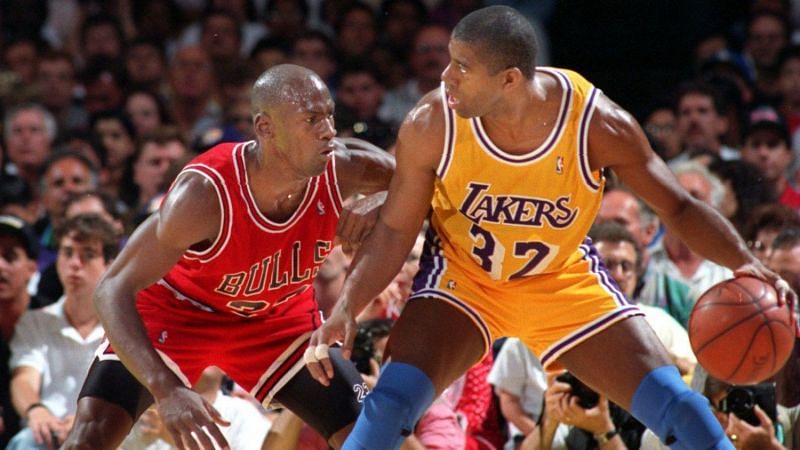 Michael Jordan guarding Magic Johnson. Photo Credit: TNS.