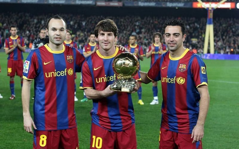Messi posing with his second Ballon d&#039;Or at the Camp Nou alongside Iniesta and Xavi