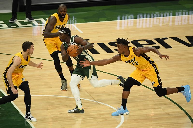 Jrue Holiday #21 of the Milwaukee Bucks drives against Dewayne Dedmon #21 and &lt;a href=&#039;https://www.sportskeeda.com/basketball/jimmy-butler/&#039; target=&#039;_blank&#039; rel=&#039;noopener noreferrer&#039;&gt;Jimmy Butler&lt;/a&gt; #22 of the Miami Heat