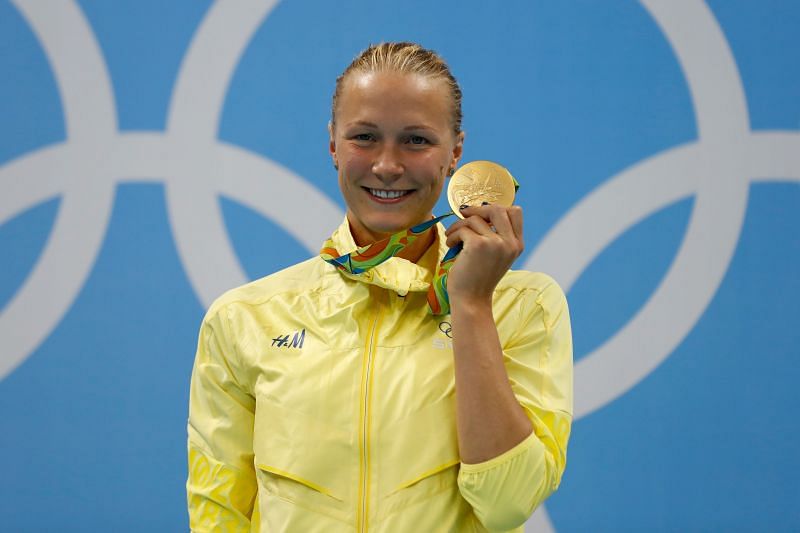 Gold medalist Sarah Sjostrom of Sweden poses on the podium during the medal ceremony for the Women&#039;s 100m Butterfly Final on Day 2 of the Rio 2016 Olympic Games at the Olympic Aquatics Stadium
