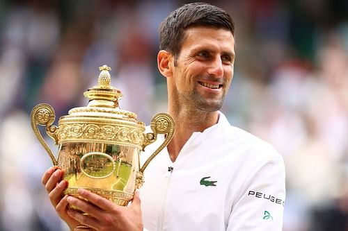 Novak Djokovic is all smiles after hoisting his 20th Grand Slam title aloft at Wimbledon 2021.