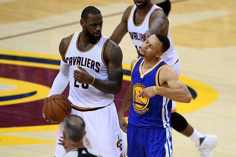 Stephen Curry #30 of the Golden State Warriors reacts to a foul call during the fourth quarter as LeBron James #23 of the Cleveland Cavaliers looks on in the 2016 NBA Final