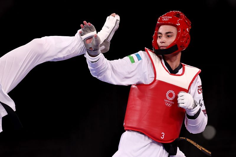 Ulugbek Rashitov of Team Uzbekistan in action in men&#039;s 68kg taekwondo