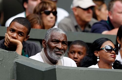 Richard Williams watches daughters Serena Williams and Venus Williams play against each other at the Wimbledon Lawn Tennis Championships in July 2010 in London, England