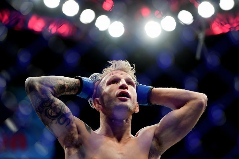 T.J. Dillashaw reacts after losing to Henry Cejudo at UFC Fight Night 143