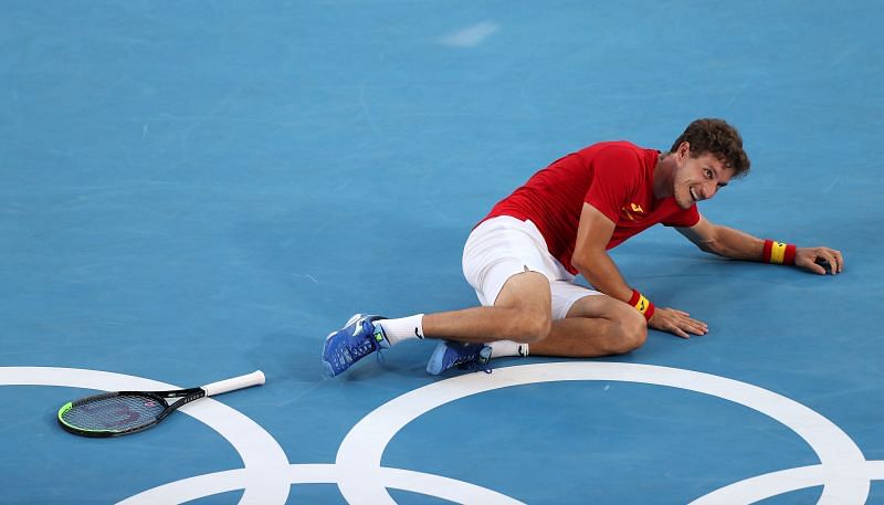 Pablo Carreno Busta celebrates after winning the Bronze medal at the 2020 Tokyo Games