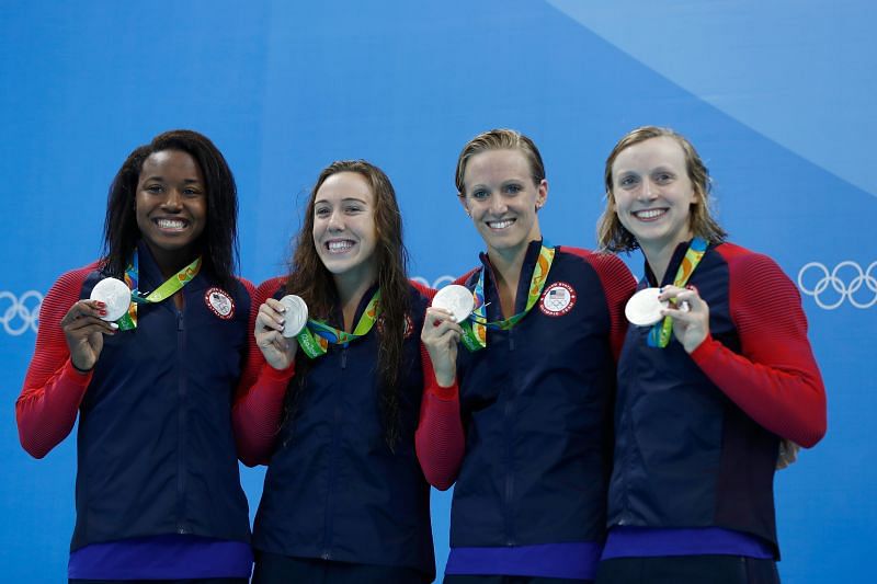 Silver medalist Simone Manuel, Abbey Weitzeil, Dana Vollmer and Kate Ledecky of the United States pose during the medal ceremony for the Final of the Women&#039;s 4 x 100m Freestyle Relay on Day 1 of the Rio 2016 Olympic Games