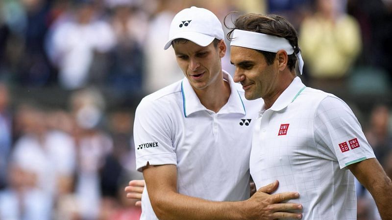 Hubert Hurkacz dumped out eight-time champion Roger Federer (right) in the Wimbledon quarterfinals.