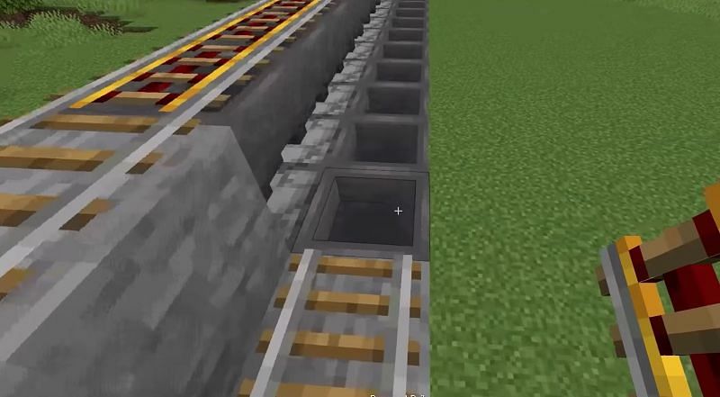 The builder is about to cover the second row of hoppers with powered rails (Image via ShulkerCraft on YouTube)