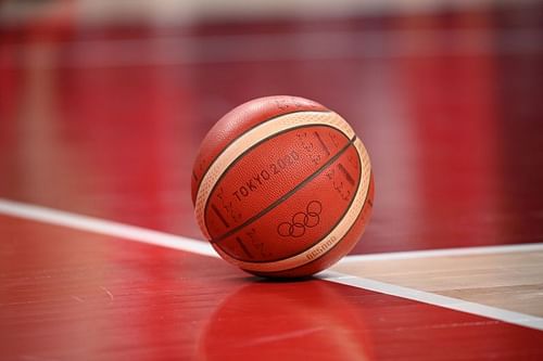 The official Tokyo 2020 Olympic basketball lays on the court.