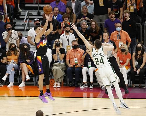 Devin Booker #1 against Pat Connaughton #24