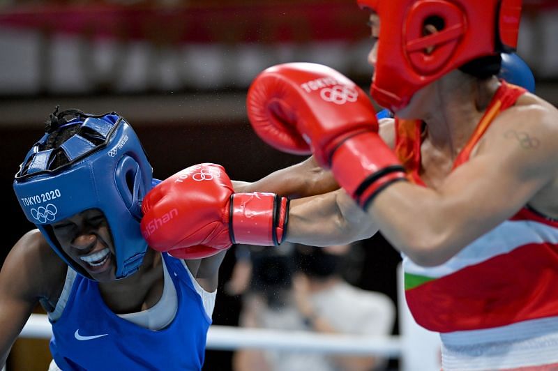 Mary Kom of India (in red) exchanges punches with Miguelina Hernandez Garcia of Dominican Republic during the Women&#039;s Fly (48-51kg)Boxing
