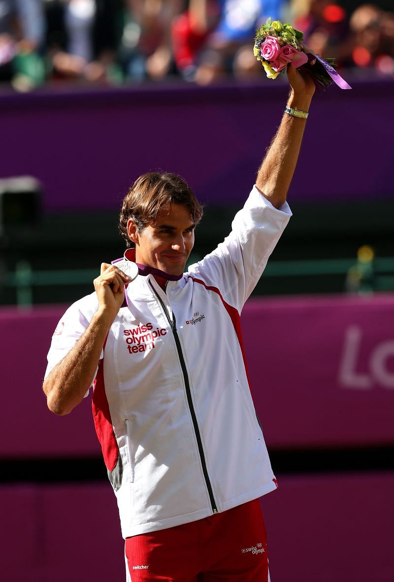 Silver medalist Roger Federer poses during the medal ceremony at the London 2012 Olympic Games