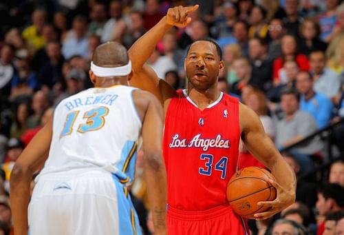 Willie Green #34 of the Los Angeles Clippers controls the ball against Corey Brewer #13 of the Denver Nuggets at the Pepsi Center on March 7, 2013