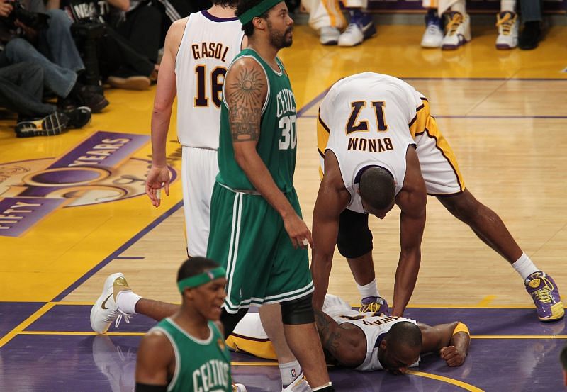 Andrew Bynum #17 of the Los Angeles Lakers helps up Kobe Bryant #24 against the Boston Celtics in Game Two of the 2010 NBA Finals