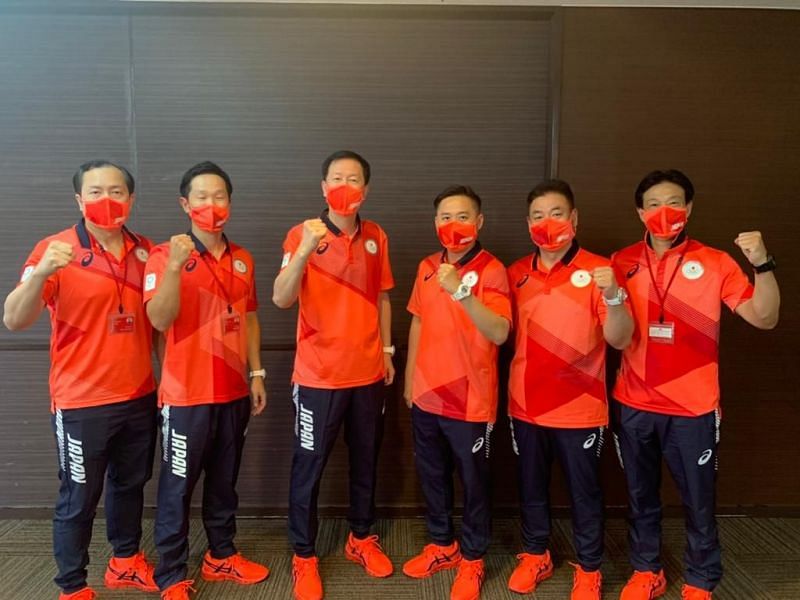 Japan&#039;s men&#039;s doubles coach Tan Kim Her (extreme left) with the other coaches of Japan badminton team