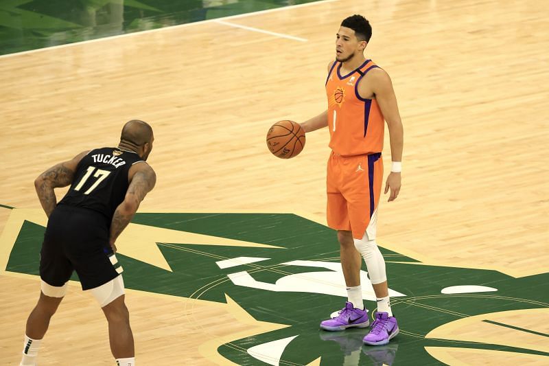 Devin Booker (right) in action