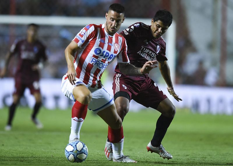 Gonzalo Montiel of Argentina's River Plate heads the ball during a