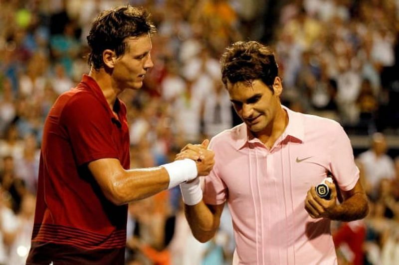 Tomas Berdych and Roger Federer at the net after their second-round match at the Athens Olympics in 2004