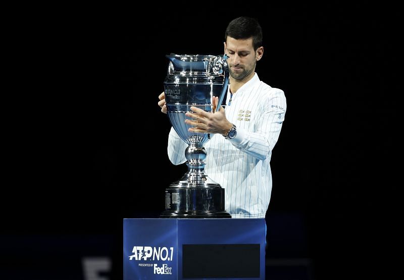 Novak Djokovic collects his trophy after being announced as ATP Tour end of year world No. 1 in November 2020