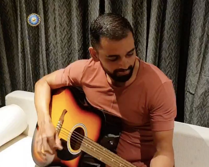 Deepak Chahar playing the guitar