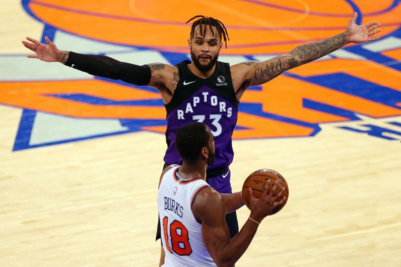 Alec Burks (#18) of the New York Knicks in action against Gary Trent Jr. (#33) of the Toronto Raptors