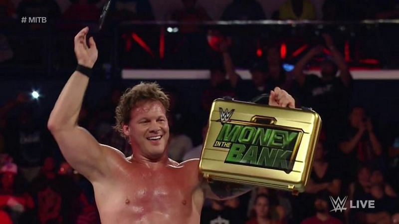 Chris Jericho holding the Money in the Bank briefcase in 2016