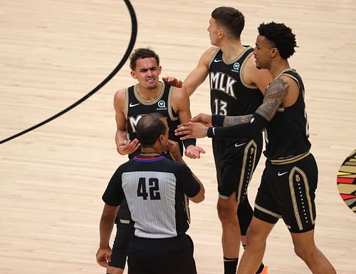 Trae Young #11 of the Atlanta Hawks argues a technical foul.